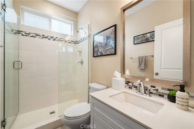 2677 E Tyler St, Long Beach, CA 90810 - bathroom with vanity, a stall shower, toilet, and tasteful backsplash