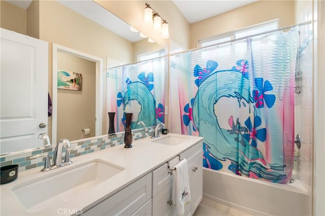 2677 E Tyler St, Long Beach, CA 90810 - full bathroom featuring backsplash, double vanity, a sink, and shower / bath combo