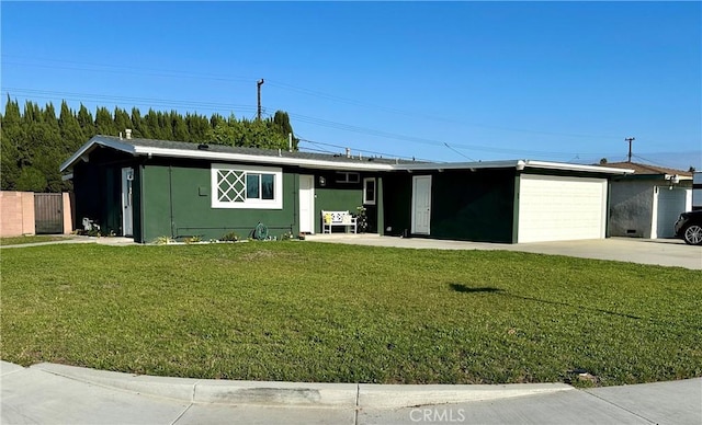single story home with a garage, a front lawn, fence, and concrete driveway