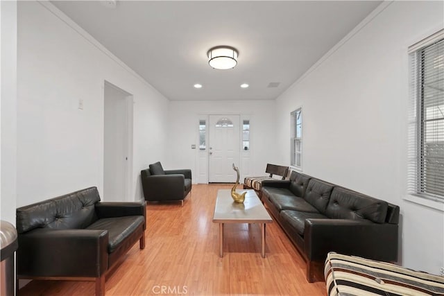 2989 W 12th St, Los Angeles, CA 90006 - living area featuring plenty of natural light, light wood-style flooring, crown molding, and recessed lighting