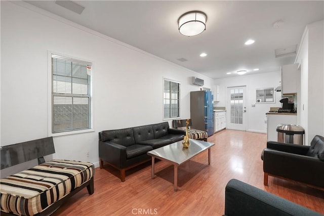 2989 W 12th St, Los Angeles, CA 90006 - living area featuring light wood finished floors, ornamental molding, recessed lighting, and an AC wall unit