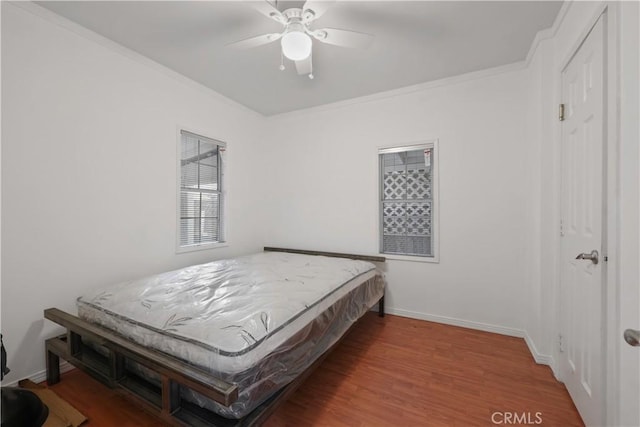 2989 W 12th St, Los Angeles, CA 90006 - bedroom featuring wood finished floors, crown molding, ceiling fan, and baseboards
