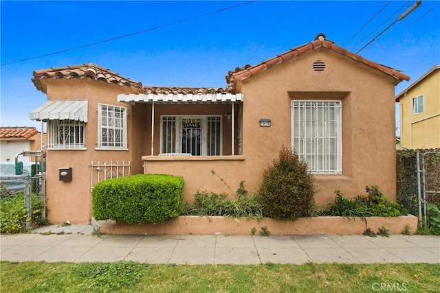 159 E 105th St, Los Angeles, CA 90003 - mediterranean / spanish house with stucco siding and a tiled roof