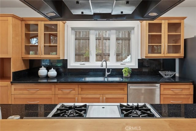 kitchen featuring a sink, stainless steel dishwasher, glass insert cabinets, extractor fan, and freestanding refrigerator