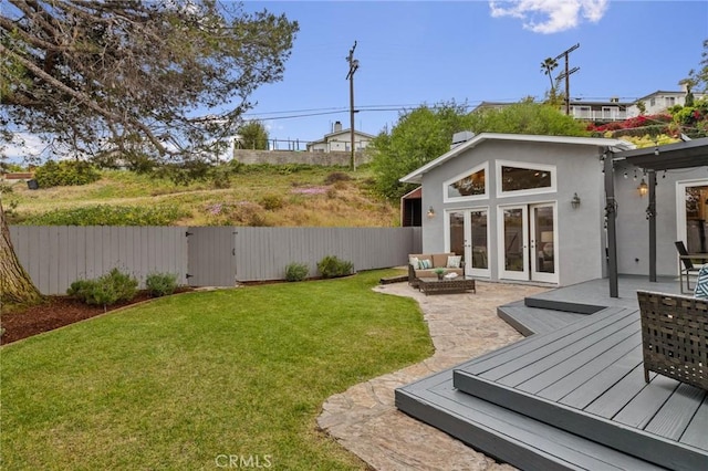 view of yard featuring a wooden deck and outdoor lounge area