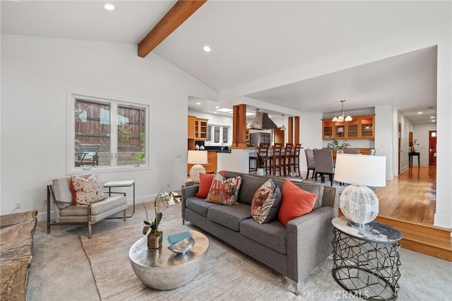 living room with a chandelier, recessed lighting, light colored carpet, and baseboards