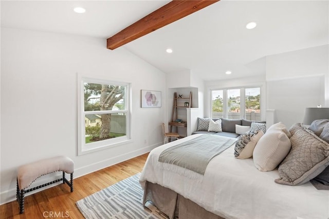 bedroom with recessed lighting, wood finished floors, and baseboards