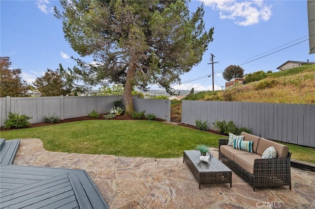 view of yard with an outdoor living space and a patio