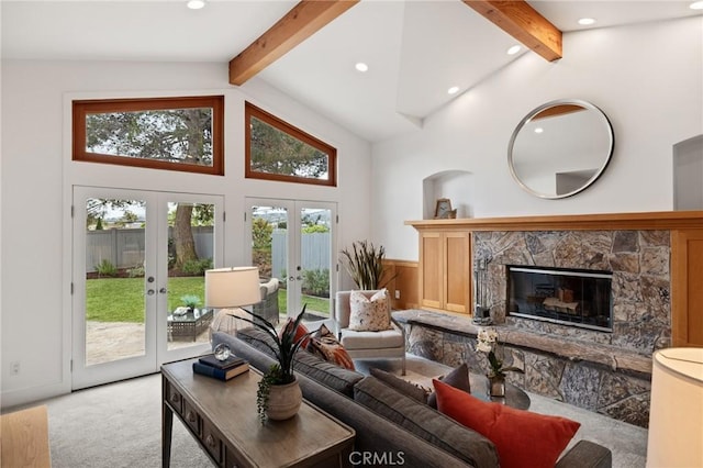 living room with beamed ceiling, french doors, carpet flooring, a fireplace, and recessed lighting