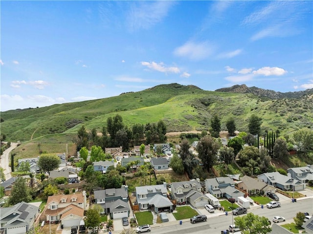 aerial view with a mountain view and a residential view