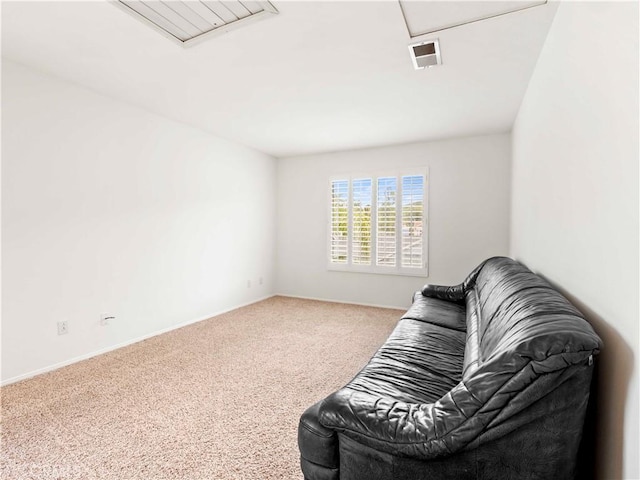 living area featuring carpet floors, baseboards, and visible vents