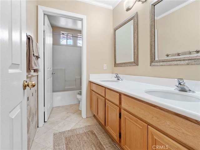 bathroom with crown molding, a sink, double vanity, and toilet