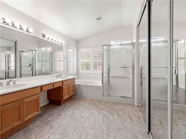 full bath featuring a shower stall, a sink, and lofted ceiling