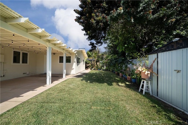 view of yard featuring a fenced backyard, a patio area, and a pergola