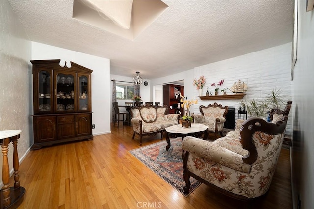 1626 Grove Pl, Fullerton, CA 92831 - living area with baseboards, a textured ceiling, and light wood finished floors