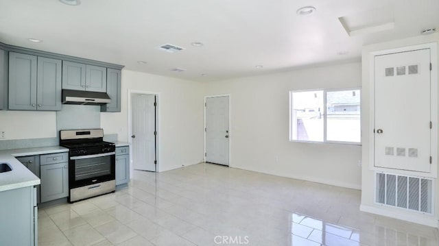 13241 Fairview St, Garden Grove, CA 92843 - kitchen with stainless steel range with gas cooktop, light countertops, under cabinet range hood, and visible vents