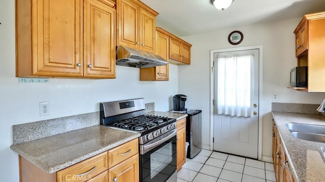 13241 Fairview St, Garden Grove, CA 92843 - kitchen with black microwave, a sink, light tile patterned floors, stainless steel gas range, and under cabinet range hood