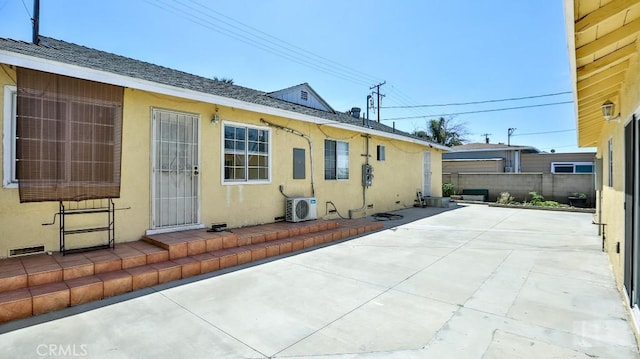 13241 Fairview St, Garden Grove, CA 92843 - rear view of house with fence, visible vents, stucco siding, electric panel, and a patio