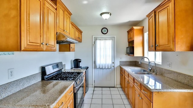 13241 Fairview St, Garden Grove, CA 92843 - kitchen with under cabinet range hood, a sink, plenty of natural light, and stainless steel gas range oven