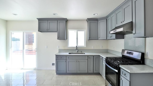 13241 Fairview St, Garden Grove, CA 92843 - kitchen with stainless steel gas stove, gray cabinetry, light countertops, a sink, and under cabinet range hood
