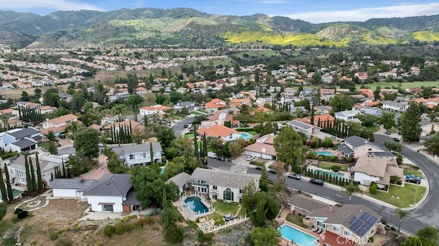 drone / aerial view with a residential view and a mountain view