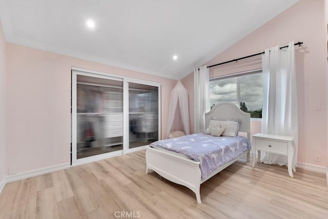 bedroom with baseboards, recessed lighting, wood finished floors, and lofted ceiling