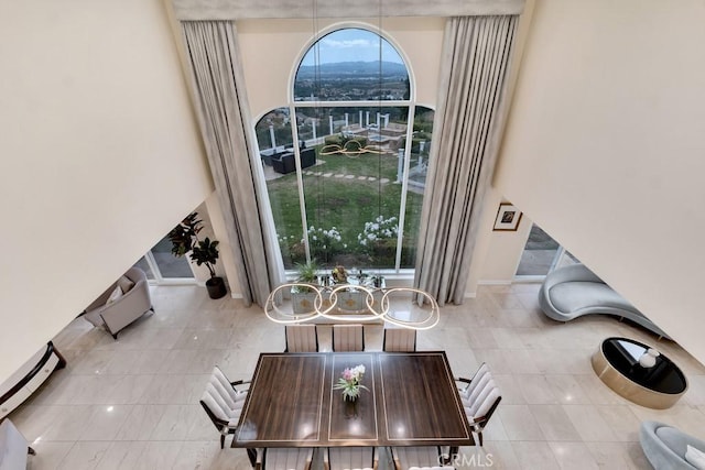 dining room featuring baseboards and a baseboard radiator