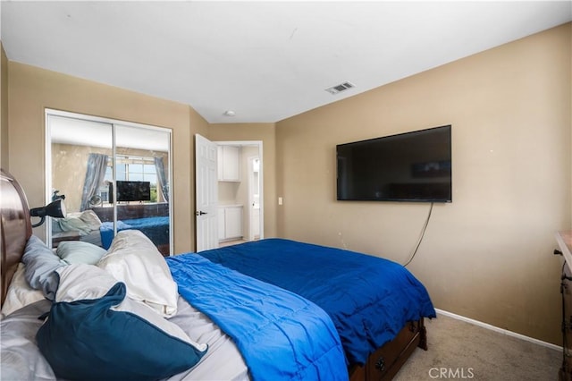 carpeted bedroom with baseboards, a closet, and visible vents
