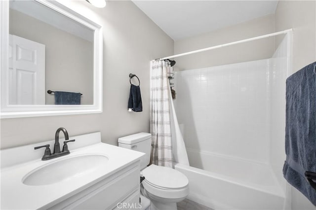 bathroom featuring vanity, shower / bathtub combination with curtain, and toilet