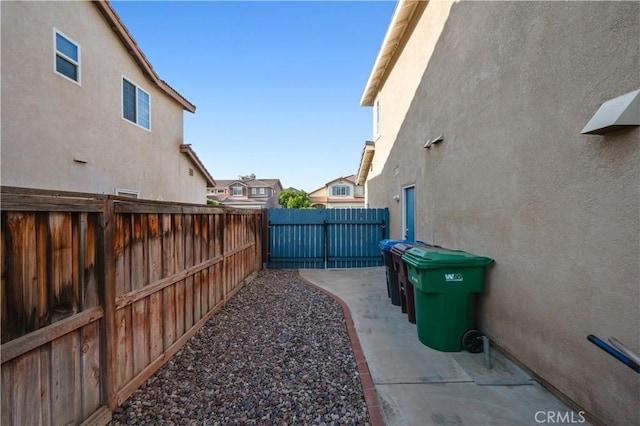 view of yard with a fenced backyard, a patio area, and a residential view