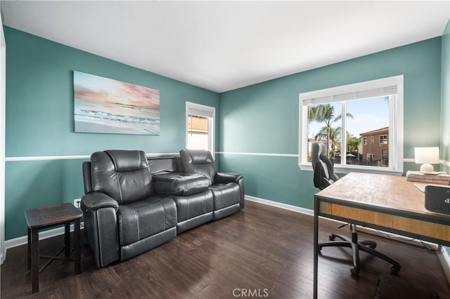 office area with baseboards and wood finished floors