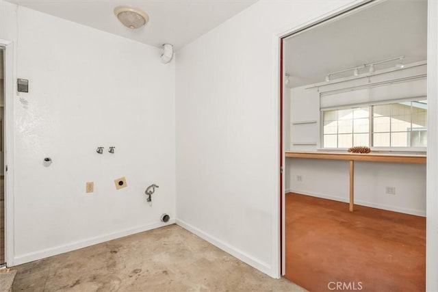 laundry room featuring laundry area, baseboards, and hookup for an electric dryer