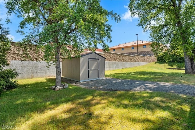 view of shed featuring fence