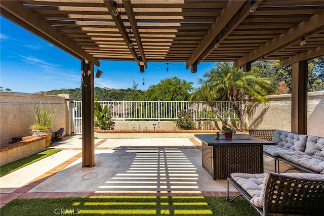 view of patio / terrace with a fenced backyard, a pergola, and outdoor lounge area