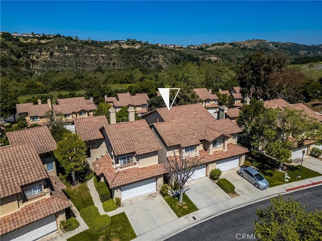 birds eye view of property featuring a residential view and a mountain view