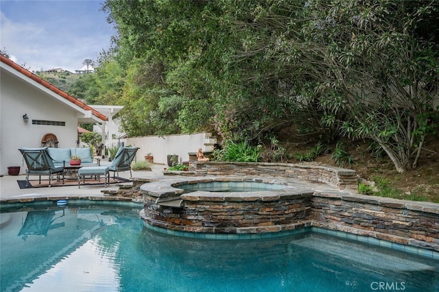 pool featuring fence, a patio, and an in ground hot tub