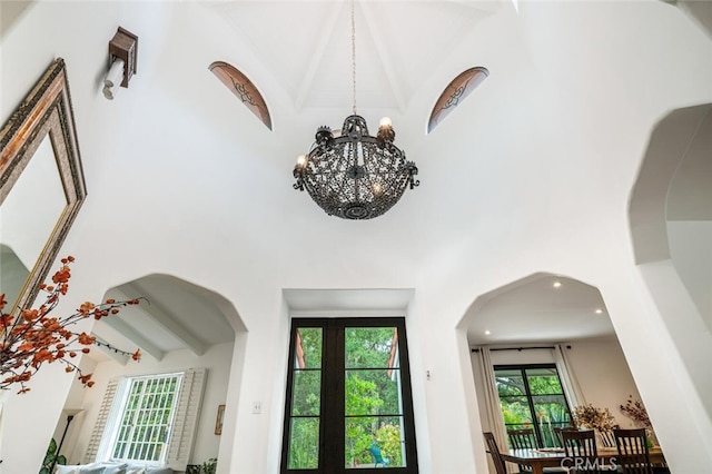 room details featuring an inviting chandelier and arched walkways
