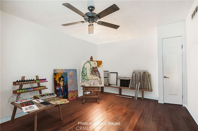 sitting room with ceiling fan, visible vents, baseboards, and hardwood / wood-style flooring