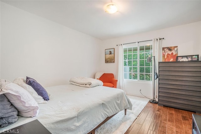 bedroom featuring wood finished floors