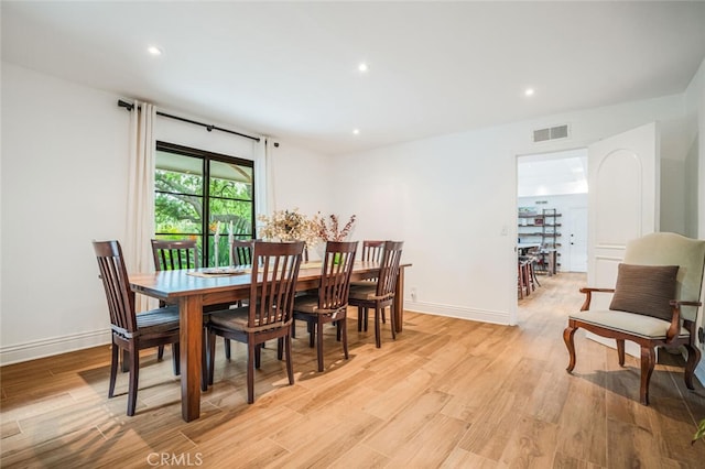 dining space with recessed lighting, baseboards, visible vents, and light wood-style floors