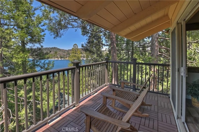 balcony featuring a water view