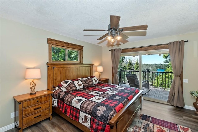 bedroom with a textured ceiling, access to outside, baseboards, and wood finished floors