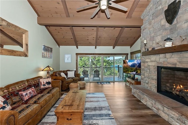 28844 Cedar Dr, Lake Arrowhead, CA 92352 - living room with a wood ceiling with exposed beams, wood finished floors, a ceiling fan, a stone fireplace, and high vaulted ceiling