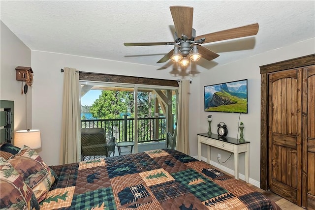 28844 Cedar Dr, Lake Arrowhead, CA 92352 - bedroom featuring access to exterior, ceiling fan, and a textured ceiling