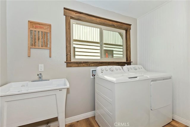 28844 Cedar Dr, Lake Arrowhead, CA 92352 - washroom featuring separate washer and dryer and light wood-style floors