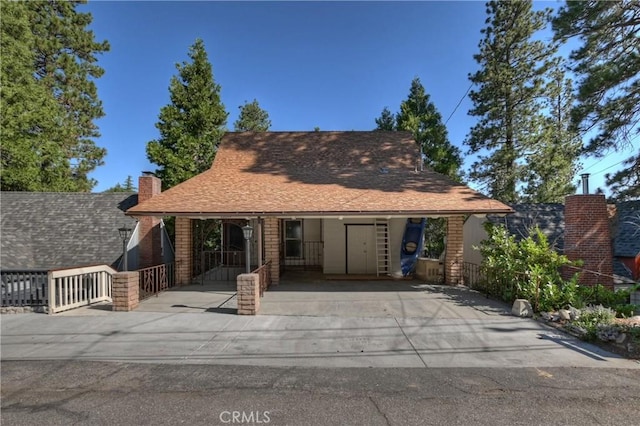28844 Cedar Dr, Lake Arrowhead, CA 92352 - view of front of property with a shingled roof and a chimney