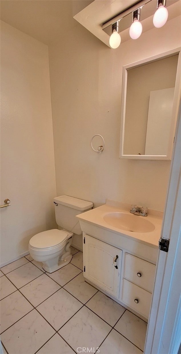 bathroom with toilet and vanity