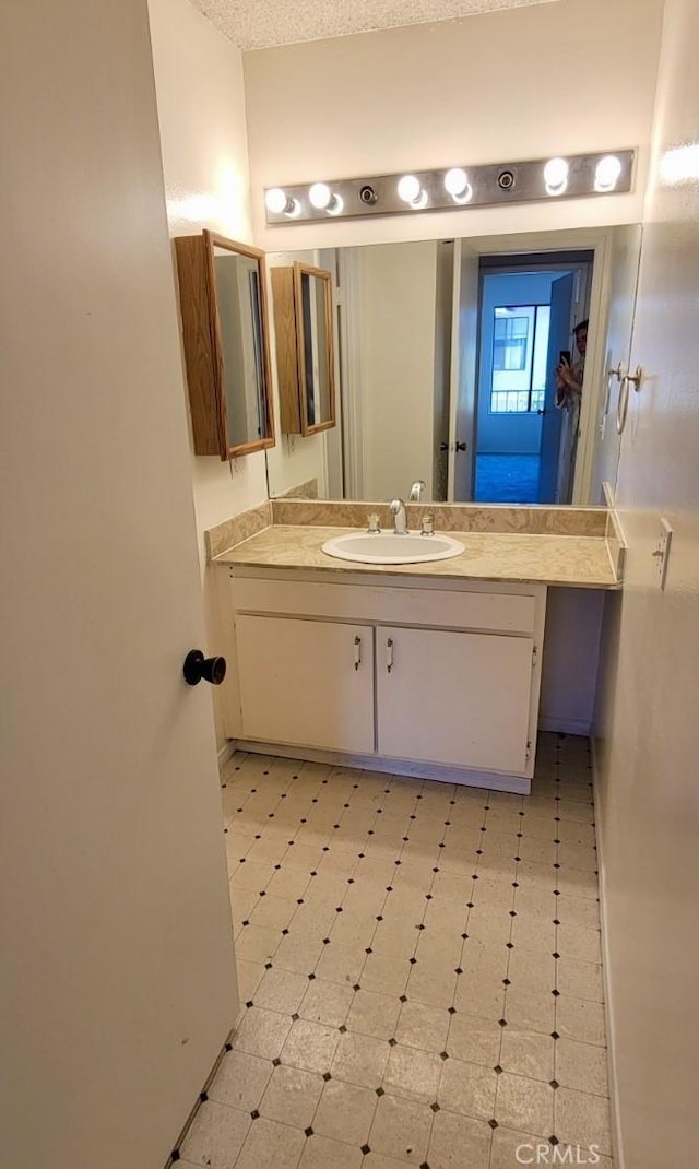 bathroom featuring tile patterned floors and vanity