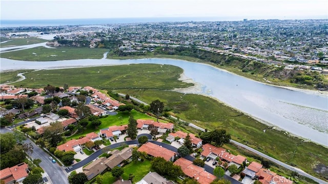 birds eye view of property featuring a water view and a residential view