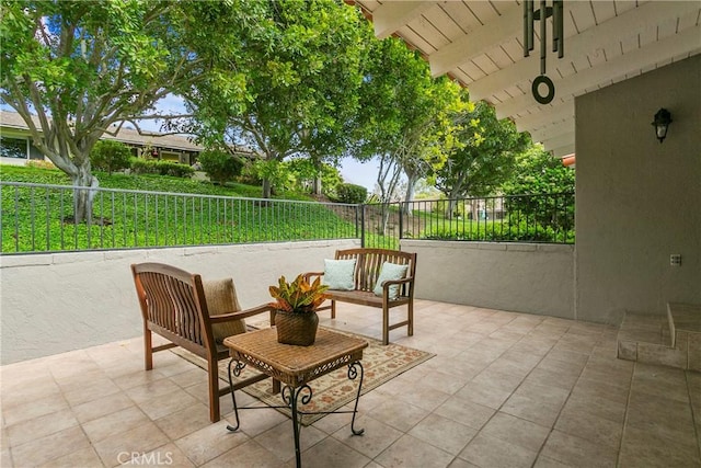 view of patio featuring fence